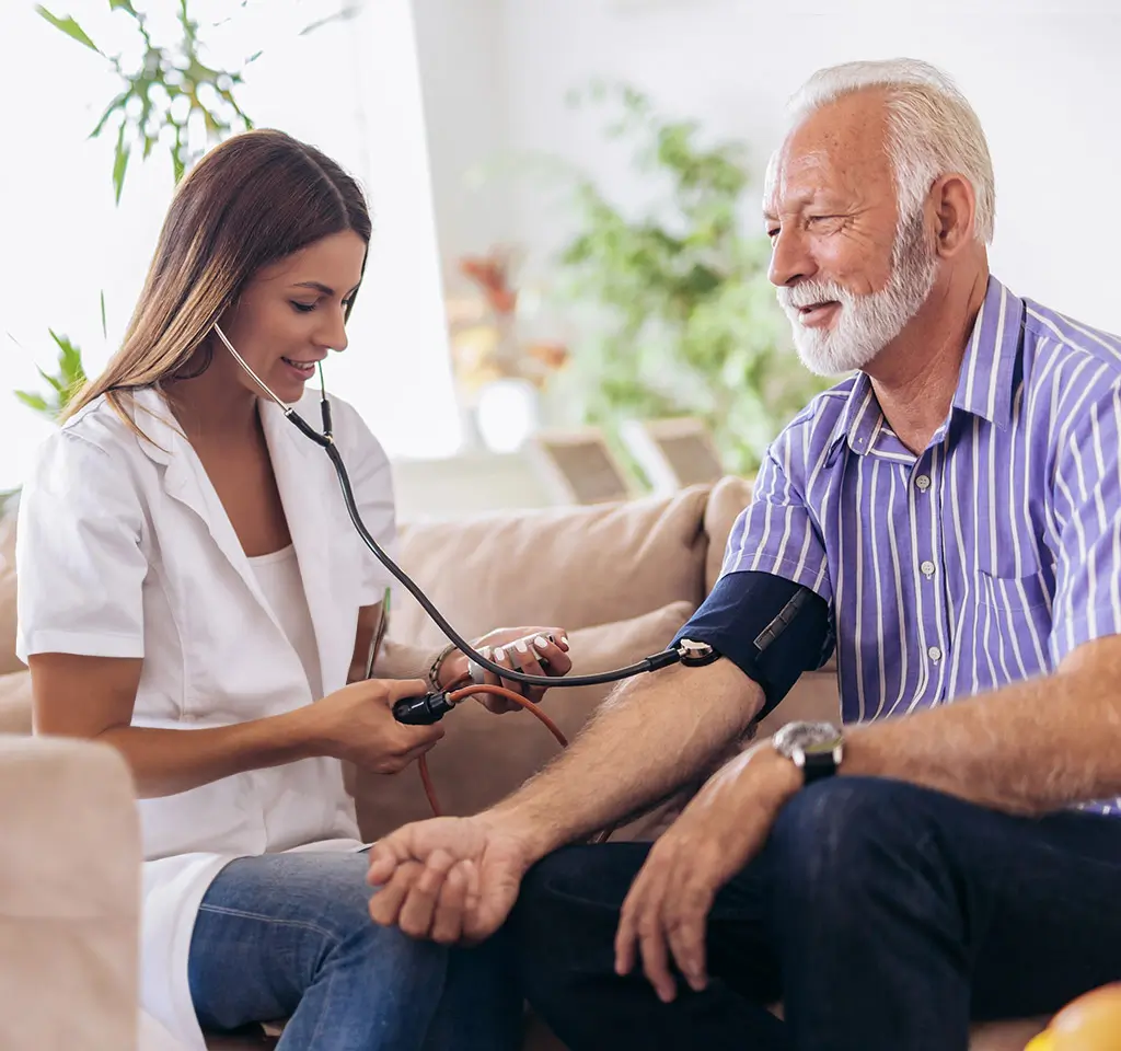 A nurse checking on a patient